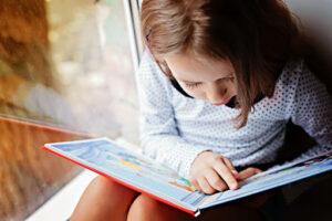 a kid with a book